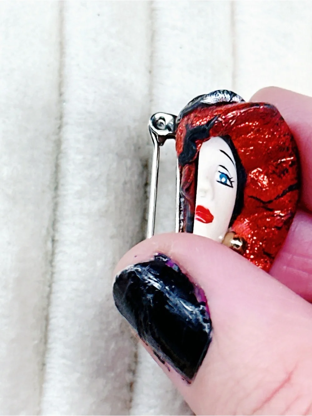 338u. Red Hat Clay Ladyface Brooch